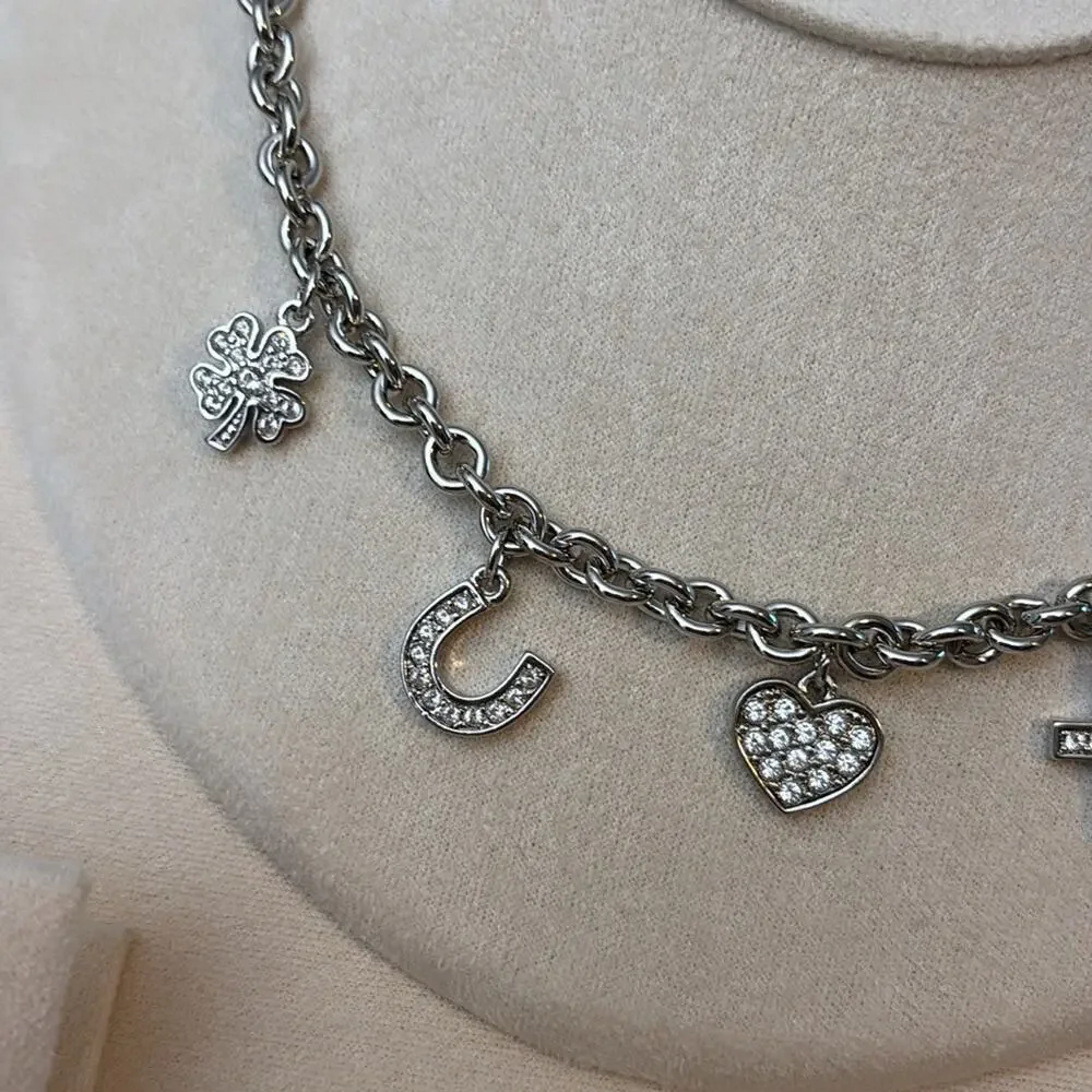 Nina Ricci Rhodium Plated Crystal Charm Necklace Heart Cross Star Horseshoe - Picture 3 of 4